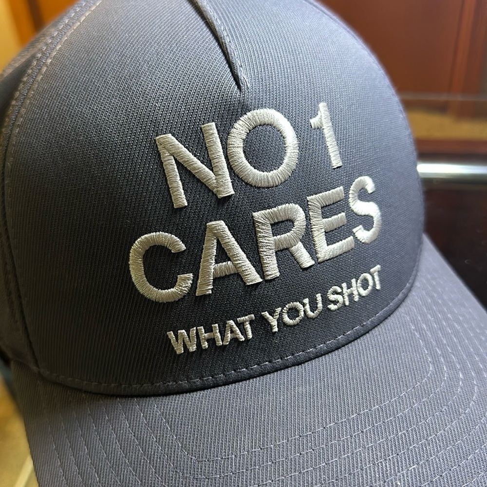 G/FORE cap. Never worn. “NO 1 CARES WHAT YOU SHOT” embroidered on front